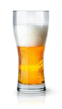 Half glass of light beer with foam isolated on white background