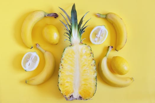 Fruits from above on yellow background