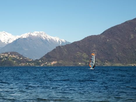 Pianello del Lario, Como - Italy - March 28, 2015: Windsurfing on the beach lying waiting for the wind.