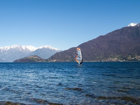 Pianello del Lario, Como - Italy - March 28, 2015: Windsurfing on the beach lying waiting for the wind.