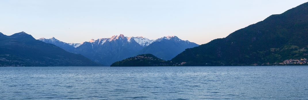 Pianello del Lario, Lake of Como, Italy: Panorama of the Lake of Como from the Beach at evening sunlight