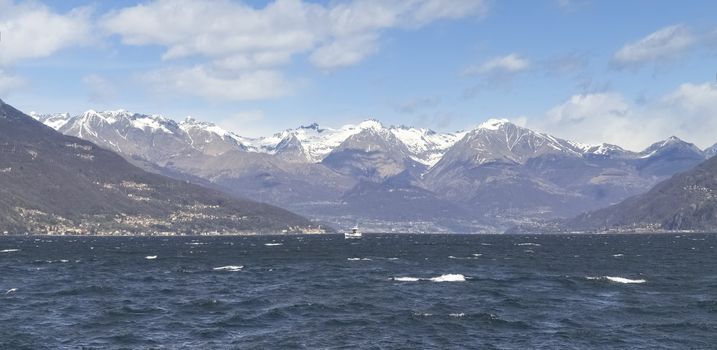 Lake of Como, Italy: Picture of the lake to the north with snow-capped mountains. The wind makes the evocative image.