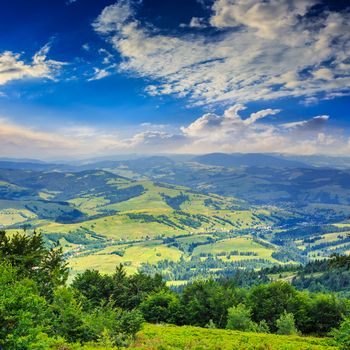 autumn landscape. village on the hillside. forest on the mountain light fall on clearing on mountains