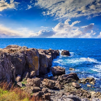 sea ​​wave attacks the boulders and is broken about them