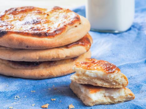 Traditional russian pasties Shanga - opened circle pie with cottage cheese. Close up view of carols cheesecake with cottage cheese.