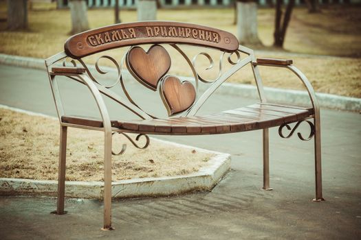 Inscription "reconciliation bench".Bench for lovers. Bench in the Park .