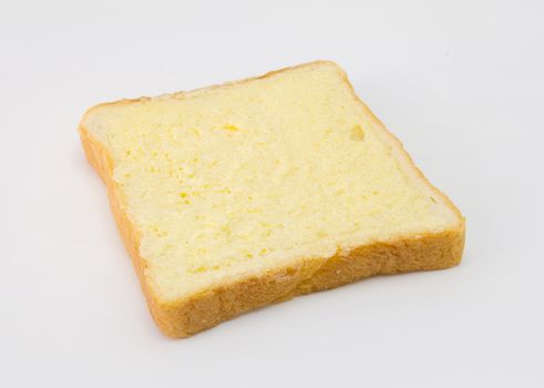 Sliced bread with sugar and butter on top isolated on white