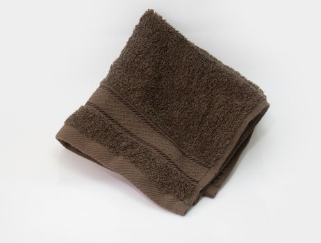 brown towel, bath towel isolated on white