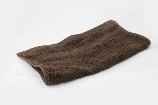 brown towel, bath towel isolated on white