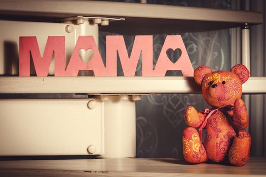 Teddy bear with a inscription " mom"