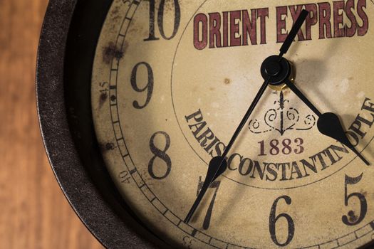 old and vintage clock on a wooden wall