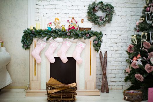 Beautiful holdiay decorated room with Christmas tree with presents under it