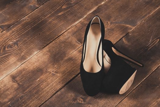 A pair of woman's shoes on a wooden floor