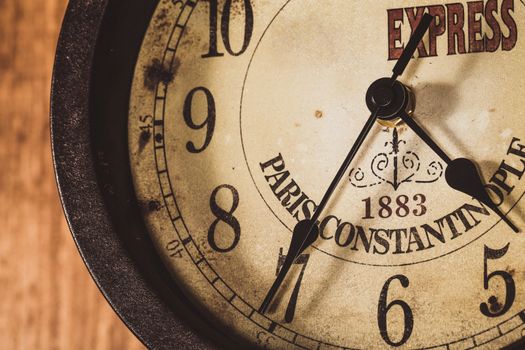 old and vintage clock on a wooden wall