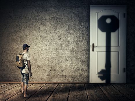 Silhouette of a man casting a key shape shadow on a room door. Conceptual image symbolizing the magical transformation as human is the key to all closed doors. Human adaptation to difficult conditions and all the intellectual labyrinths.