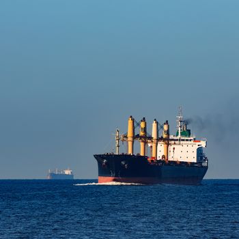 Black cargo ship sailing from the Baltic sea