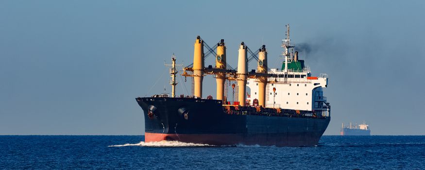 Black cargo ship sailing from the Baltic sea