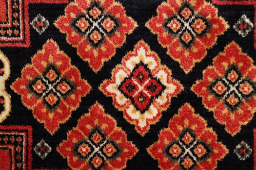 geometric  pattern old Persian carpet closeup