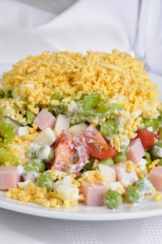 salad with ham and egg and vegetables flavored  milk sauce