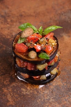 fried eggplant with diced tomatoes, capers, flavoured spices