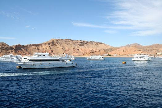The powerboat in the Red Sea against small mountains of the Sinai Peninsula