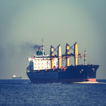 Black cargo ship sailing from the Baltic sea