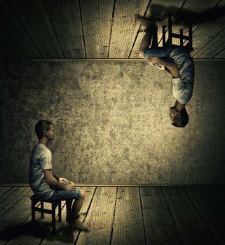 Creative idea concept with a man sitting in a dark room above and below looking at each others twin. Conceptual parallel world, alternate reality, fiction theory.