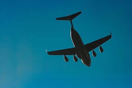 Passenger aircraft flying in the blue sky