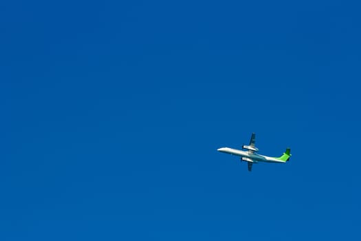 Passenger aircraft flying in the blue sky