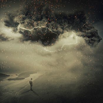 Surreal view as a young boy, stand on the sandy ground near the seaside watching a hurricane, sandstorm coming with a million fire sparkles in the sky. Adventure and life emotions.