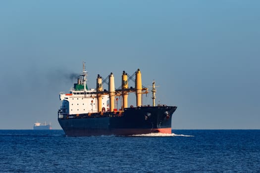 Black cargo ship sailing from the Baltic sea