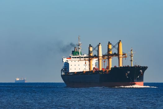 Black cargo ship sailing from the Baltic sea