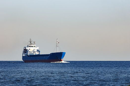 Blue cargo ship sailing from the Baltic sea