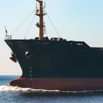 Black cargo ship sailing from the Baltic sea