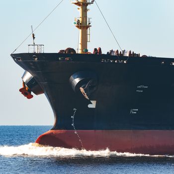 Black cargo ship sailing from the Baltic sea