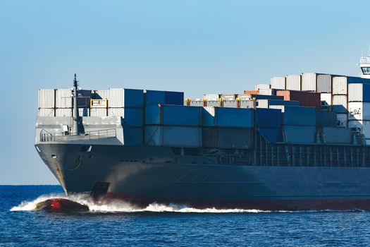 Large grey container ship moving from Baltic sea
