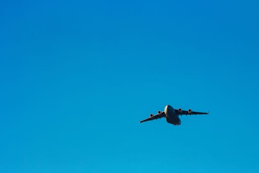 Passenger aircraft flying in the blue sky