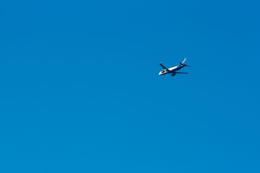 Passenger aircraft flying in the blue sky