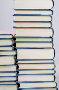 Heap of books on a white isolated background with a nib