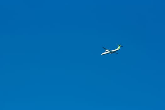 Passenger aircraft flying in the blue sky