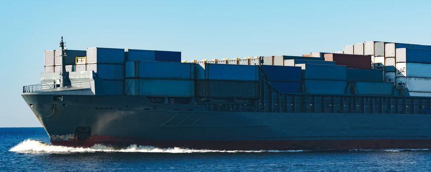 Large grey container ship moving from Baltic sea