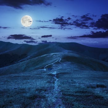 small lake near mountain curve path on a Green Hill at night in full moon light