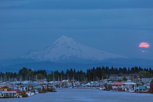 Full Moon Rising behind Mount Hood at Hayden Island in Portland Oreogn during blue hour