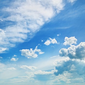                                     fluffy clouds in the blue sky