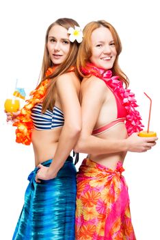 Two young girlfriends in bikini in Hawaiian image with cocktails on white background
