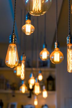 Photo burning lamps in retro style under the ceiling
