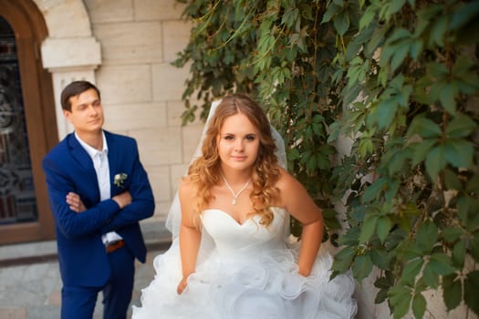 Newlyweds on a walk in the park on a warm sunny day