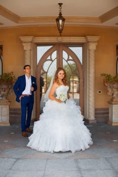 Newlyweds on a walk in the park on a warm sunny day