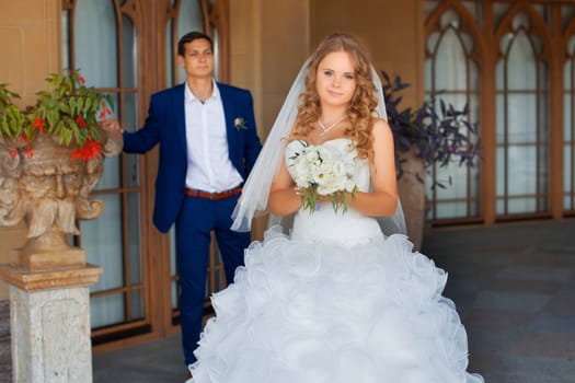 Newlyweds on a walk in the park on a warm sunny day