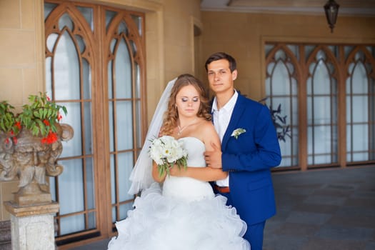 Newlyweds on a walk in the park on a warm sunny day